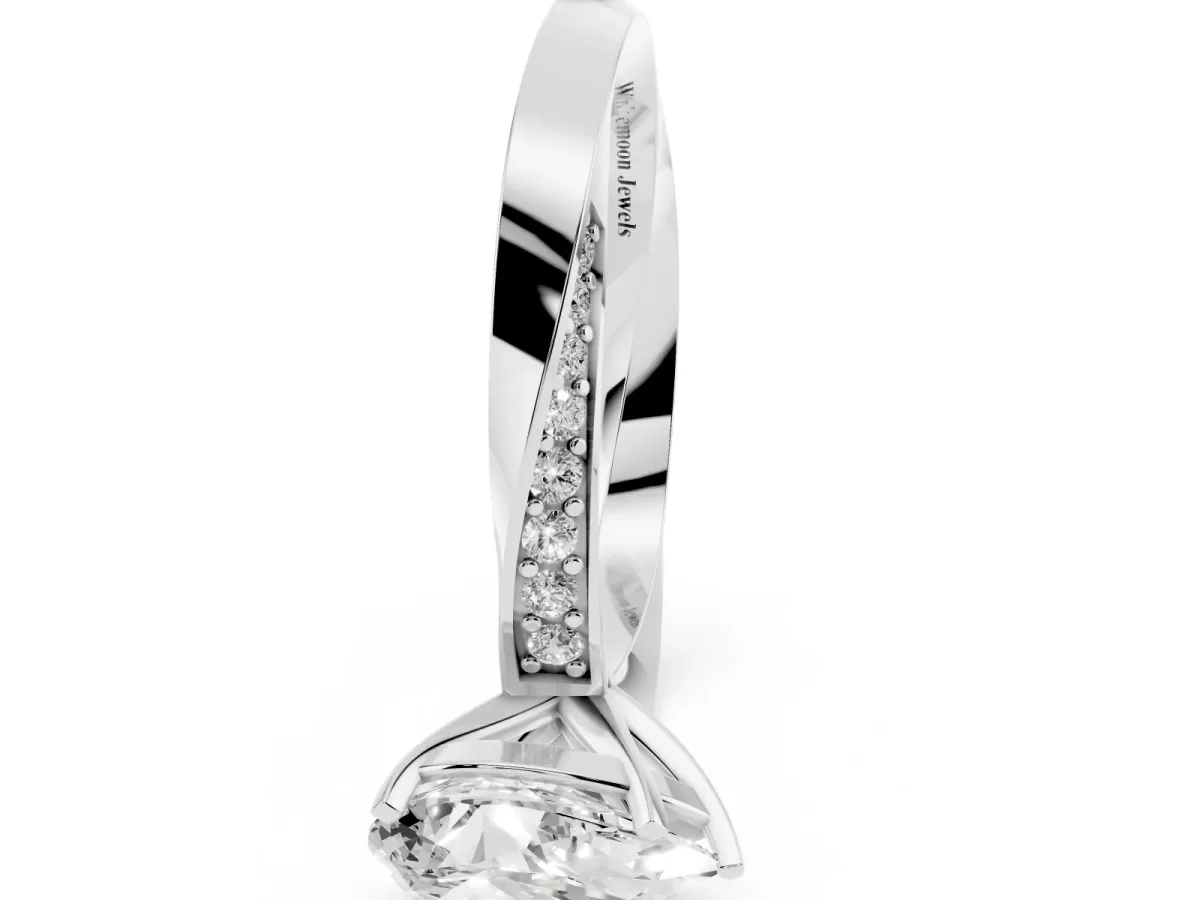 Pear Cut Diamond Engagement Ring with Side Stone Accents and Four-Prong Setting Silver