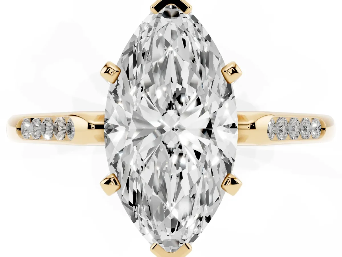 Marquise Cut Diamond Solitaire Ring with Channel Set Round Band and Prong Setting Yellow gold