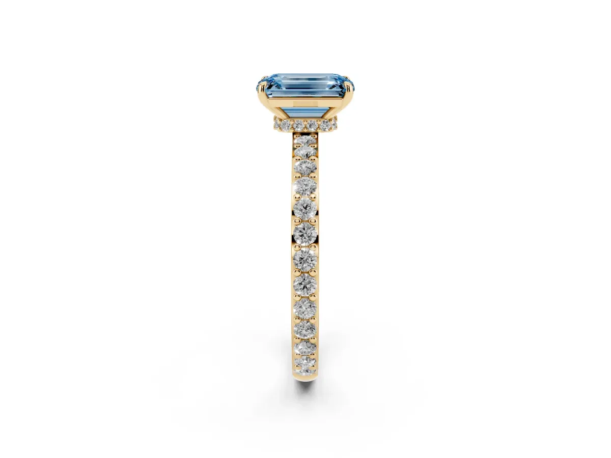 Fancy Blue Emerald Cut Diamond Pavé Engagement Ring with Round Accents and Prong Setting Yellow gold