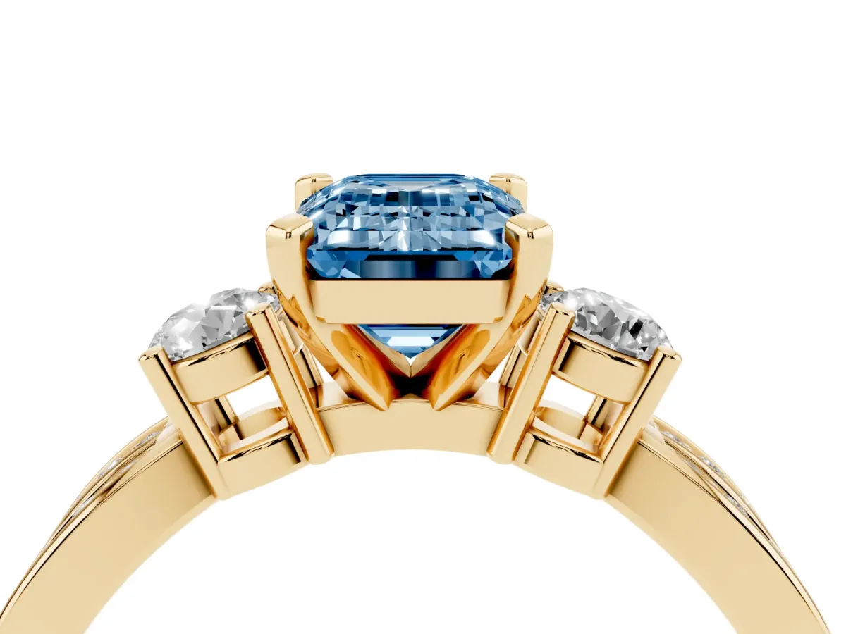 Fancy Blue Three-Stone Emerald Cut Cut Diamond Twist Band with Prong Setting Yellow gold