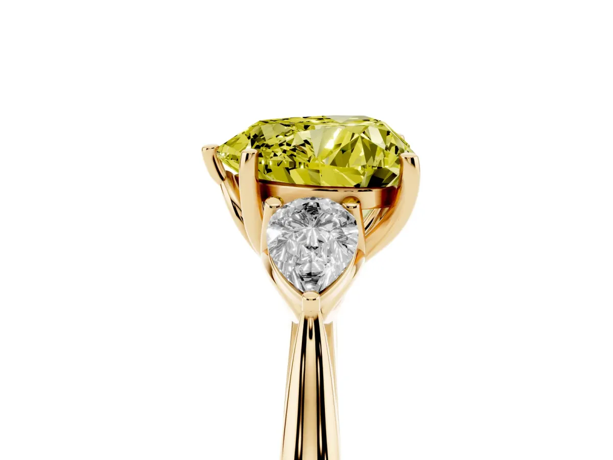 Fancy Yellow Three-Stone Heart Cut Diamond Ring with Pear Side Stones in Four-Prong Setting Yellow gold
