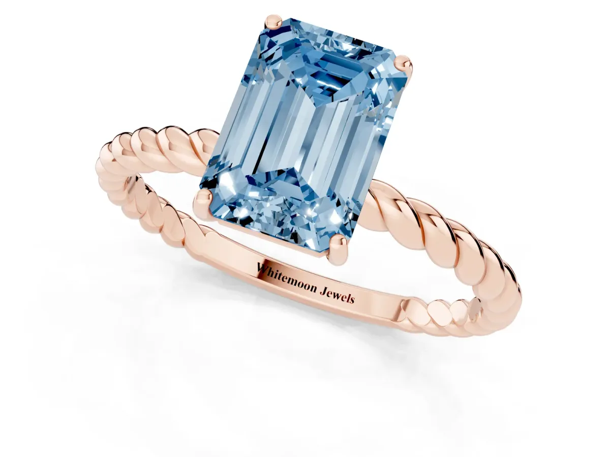 Fancy Blue Emerald Cut Solitaire Twist Band Ring with Four-Prong Setting Rose gold