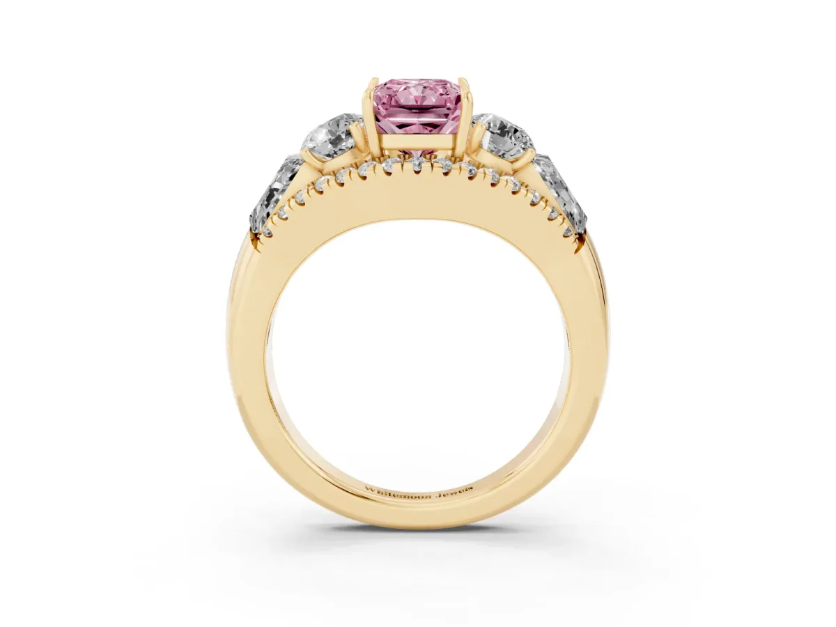 Fancy Pink Three-Stone Radiant Cut Diamond Engagement Ring with Pave Band and Prong Setting Yellow gold