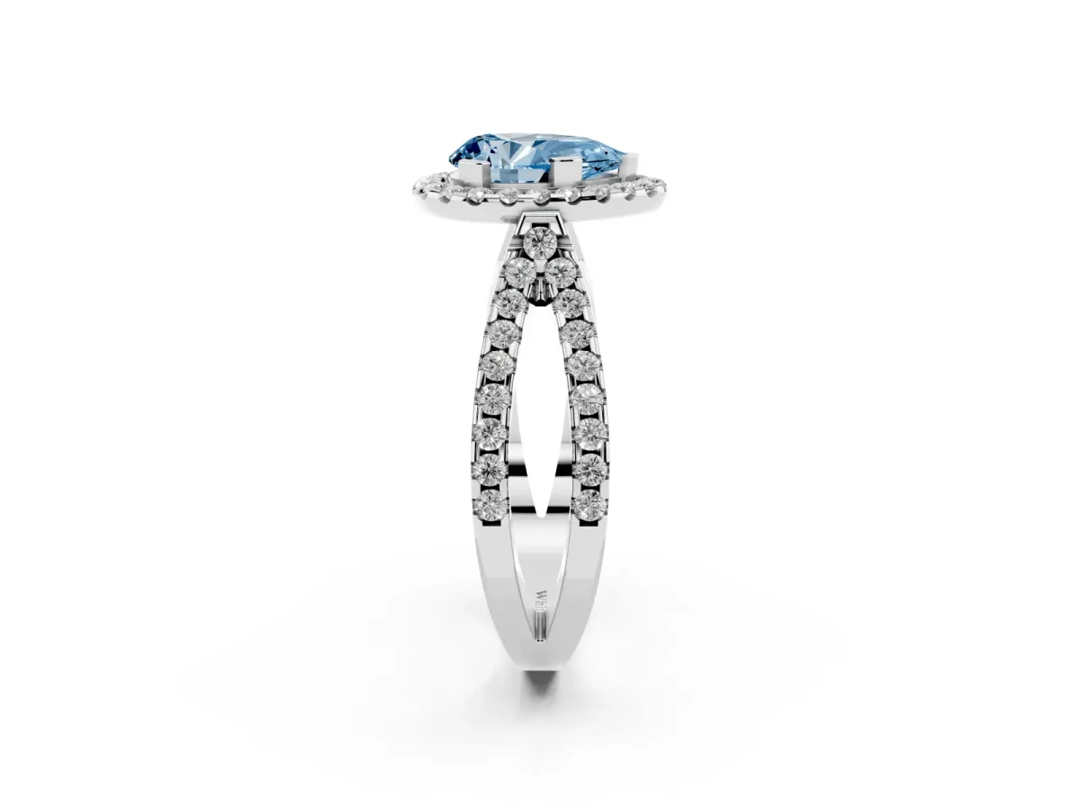 Fancy Blue Pear Cut Diamond Halo Ring with Split Shank Pavé Band and Prong Setting Silver