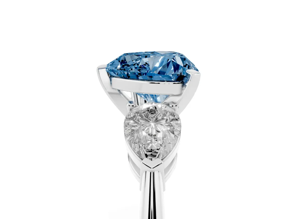 Fancy Blue Three-Stone Heart Cut Diamond Ring with Pear Side Stones and Four-Prong Setting Silver