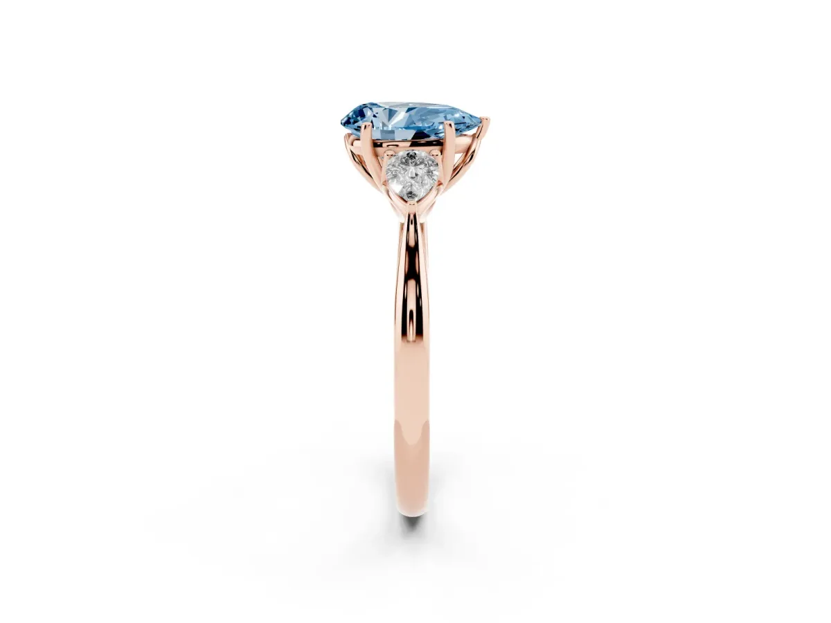 Fancy Blue Pear Cut Diamond Three-Stone Ring with Pear Side Stones and Prong Setting Rose gold