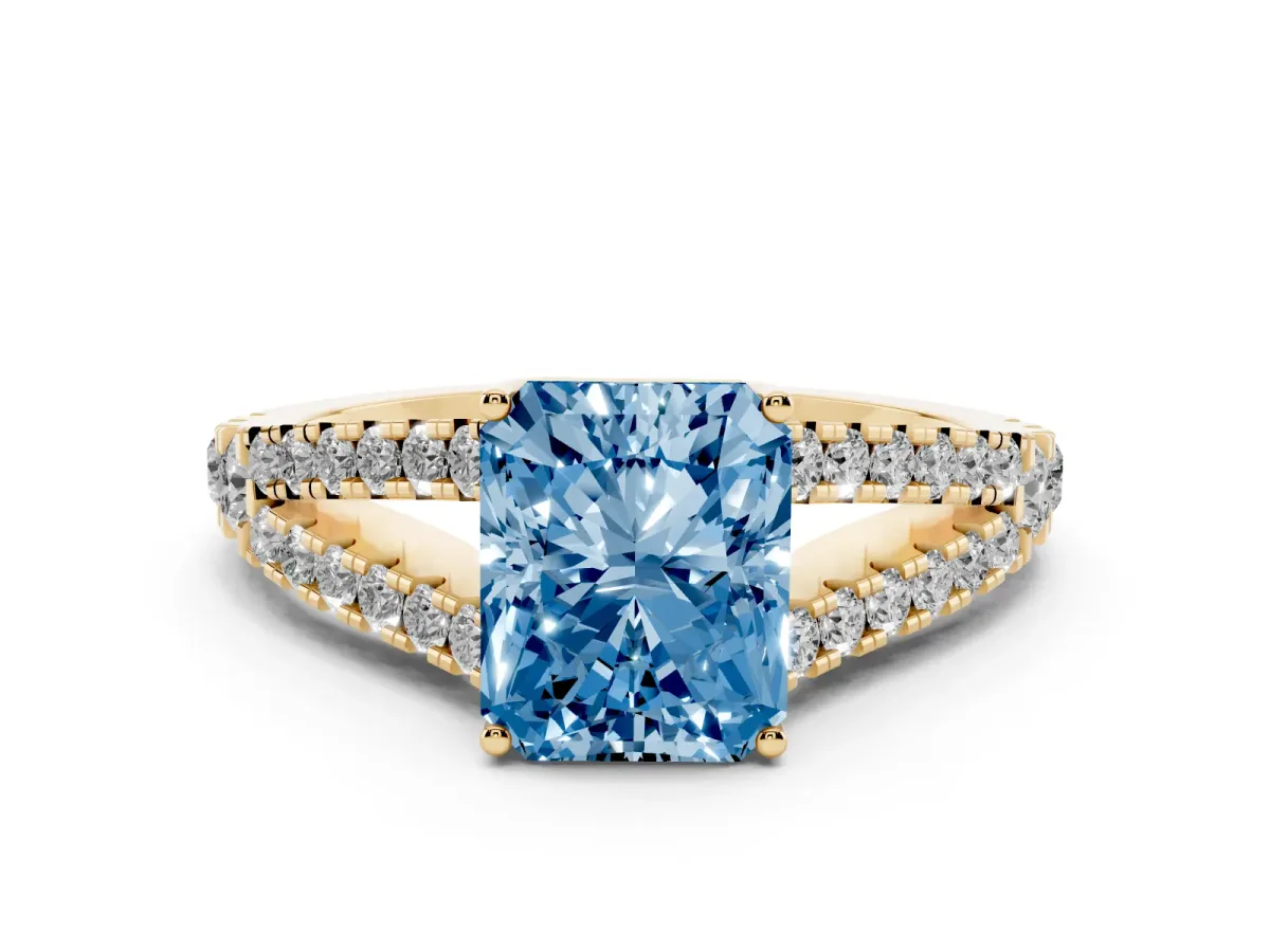 Fancy Blue Radiant Cut Diamond Split Shank Pavé Engagement Ring with Four-Prong Setting Yellow gold