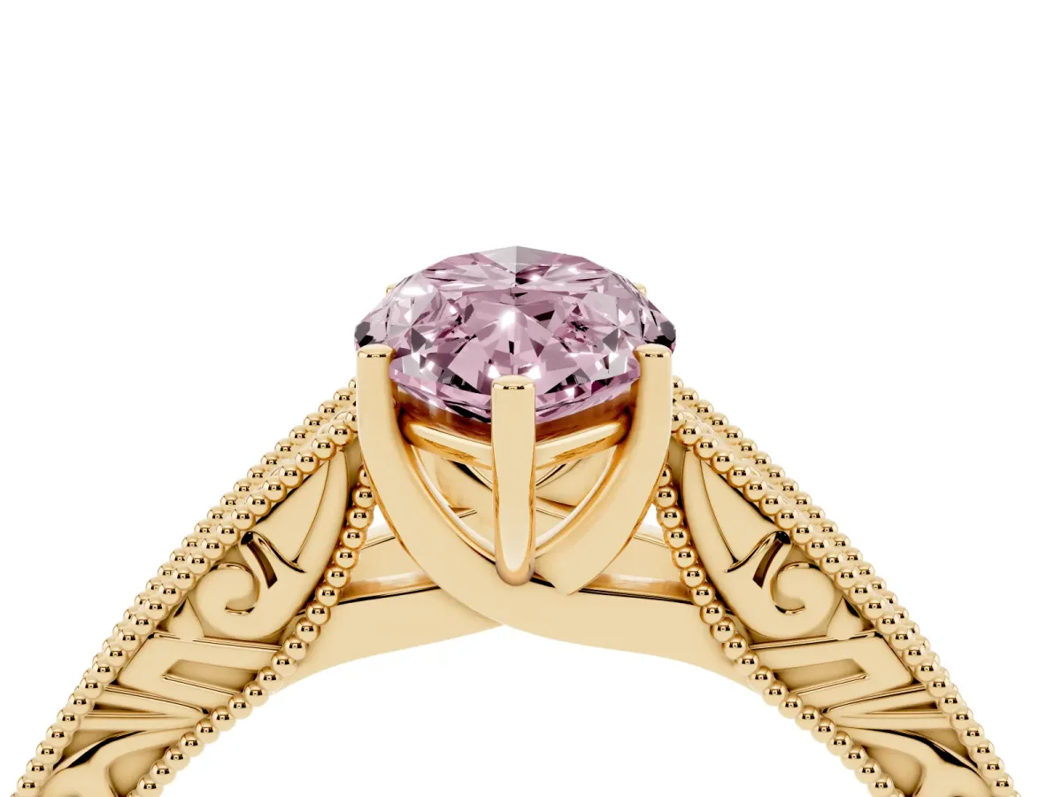 Fancy Pink Marquise Cut Diamond Solitaire Ring with Engraved Band and Four-Prong Setting Yellow gold