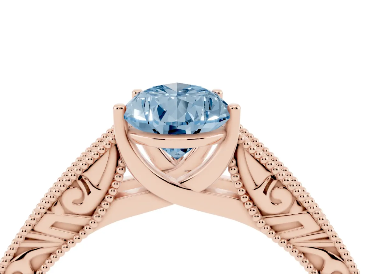 Fancy Blue Pear Cut Diamond Solitaire Ring with Engraved Band and Four-Prong Setting Rose gold