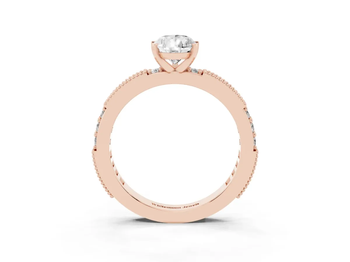 Pear Cut Solitaire with Pavé Band and Four-Prong Setting Rose gold