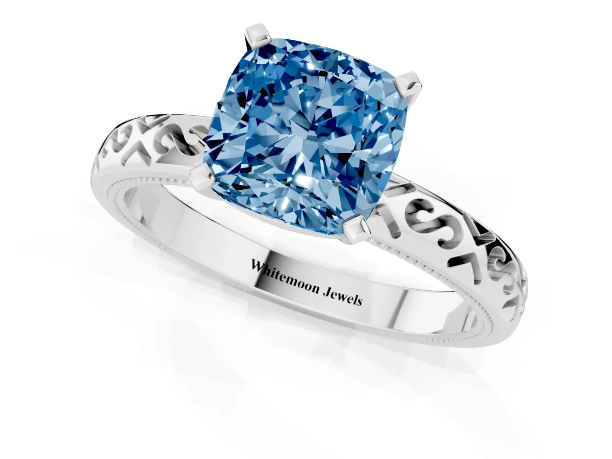 Fancy Blue Cushion Cut Solitaire Engagement Ring with Scrollwork Band and Four-Prong Setting Silver