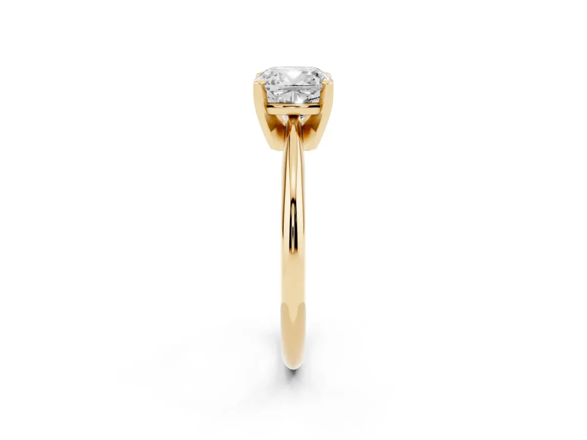 Cushion Cut Cut Solitaire Ring with Four-Prong Setting on a Classic Band Yellow gold