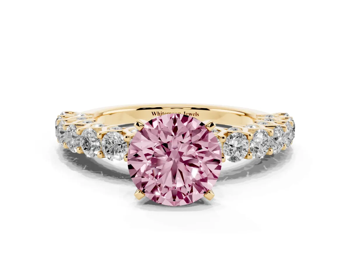 Fancy Pink Round Cut Diamond Solitaire Ring with Shared Prong Pavé Band and Four-Prong Setting Yellow gold