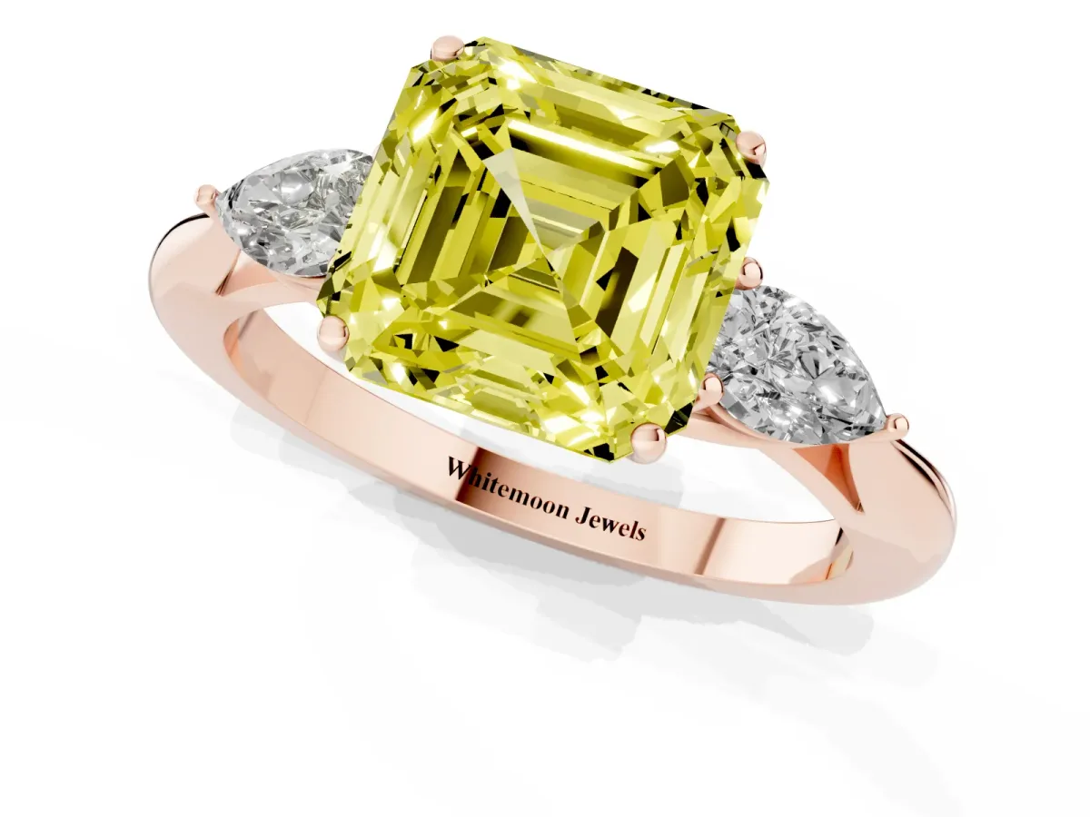Fancy Yellow Three-Stone Asscher Cut Diamond Ring with Pear Side Stones in Four-Prong Setting Rose gold