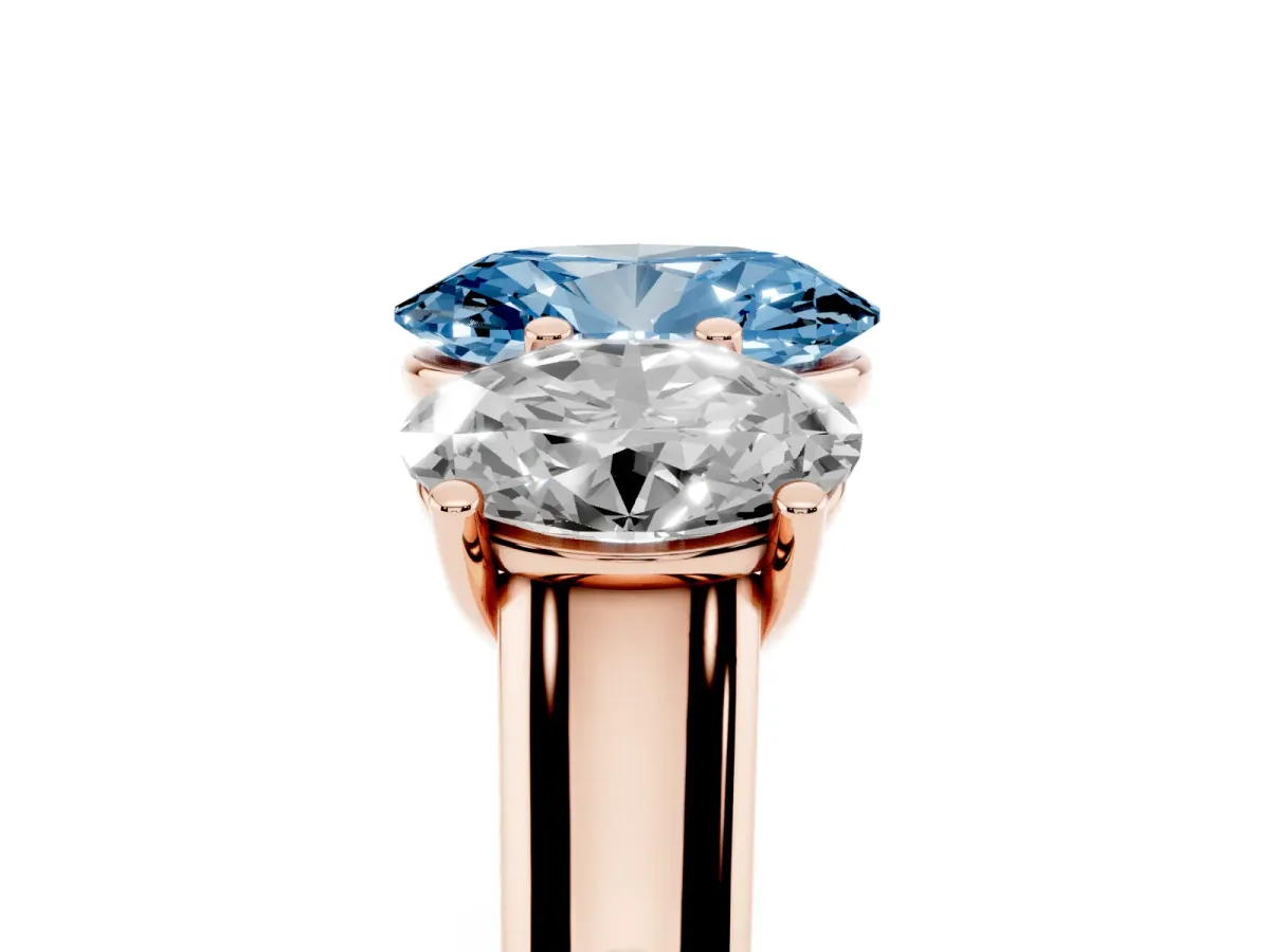 Fancy Blue Oval Cut Three-Stone Diamond Ring with Prong Setting on a Classic Band Rose gold