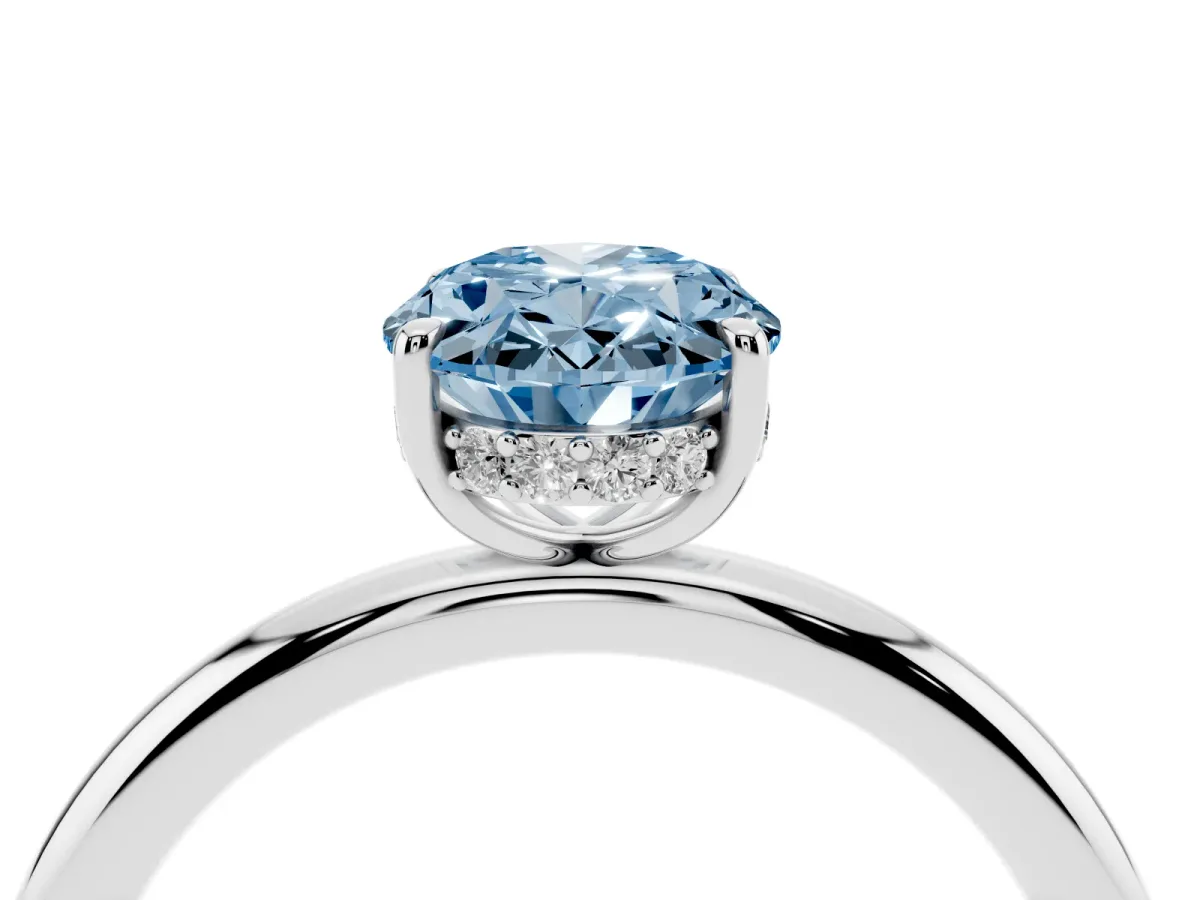 Fancy Blue Oval Cut Diamond Solitaire Ring with Thin Band and Four-Prong Setting Silver