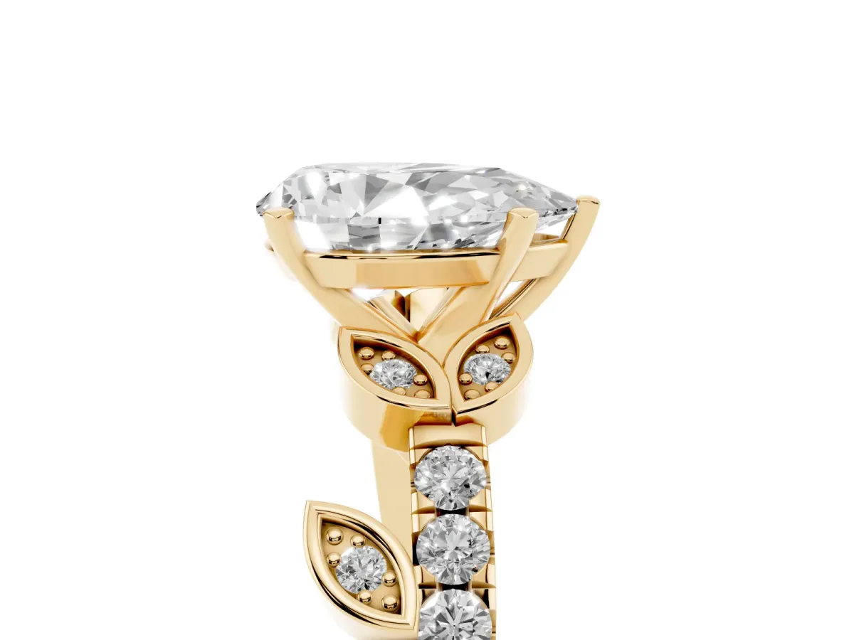 Pear Cut Solitaire Leaf-Inspired Diamond Ring with Pavé Band and Four-Prong Setting Yellow gold