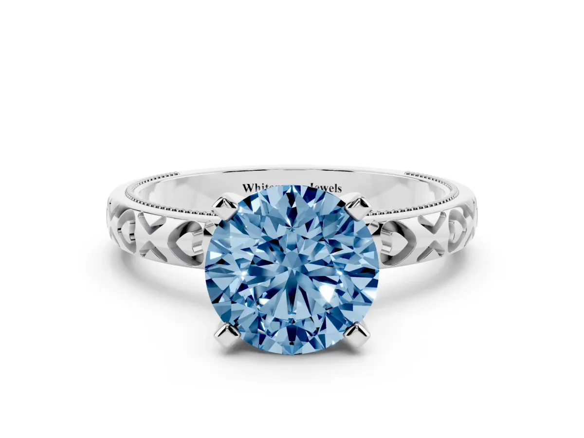 Fancy Blue Round Cut Solitaire Diamond Engagement Ring with XO Engraved Band and Four-Prong Setting Silver