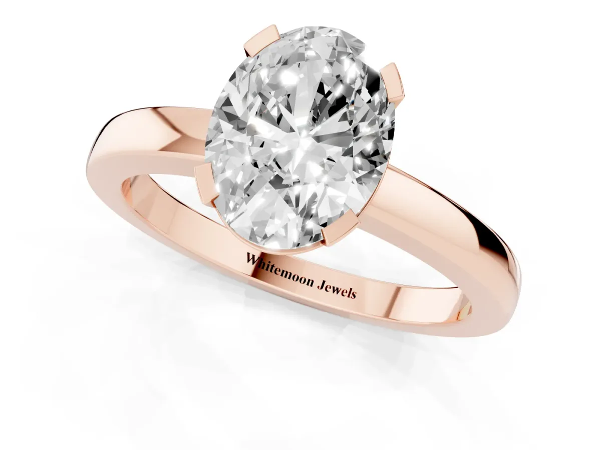 Oval Cut Cut Solitaire Ring with Four-Prong Setting and Classic Band Rose gold