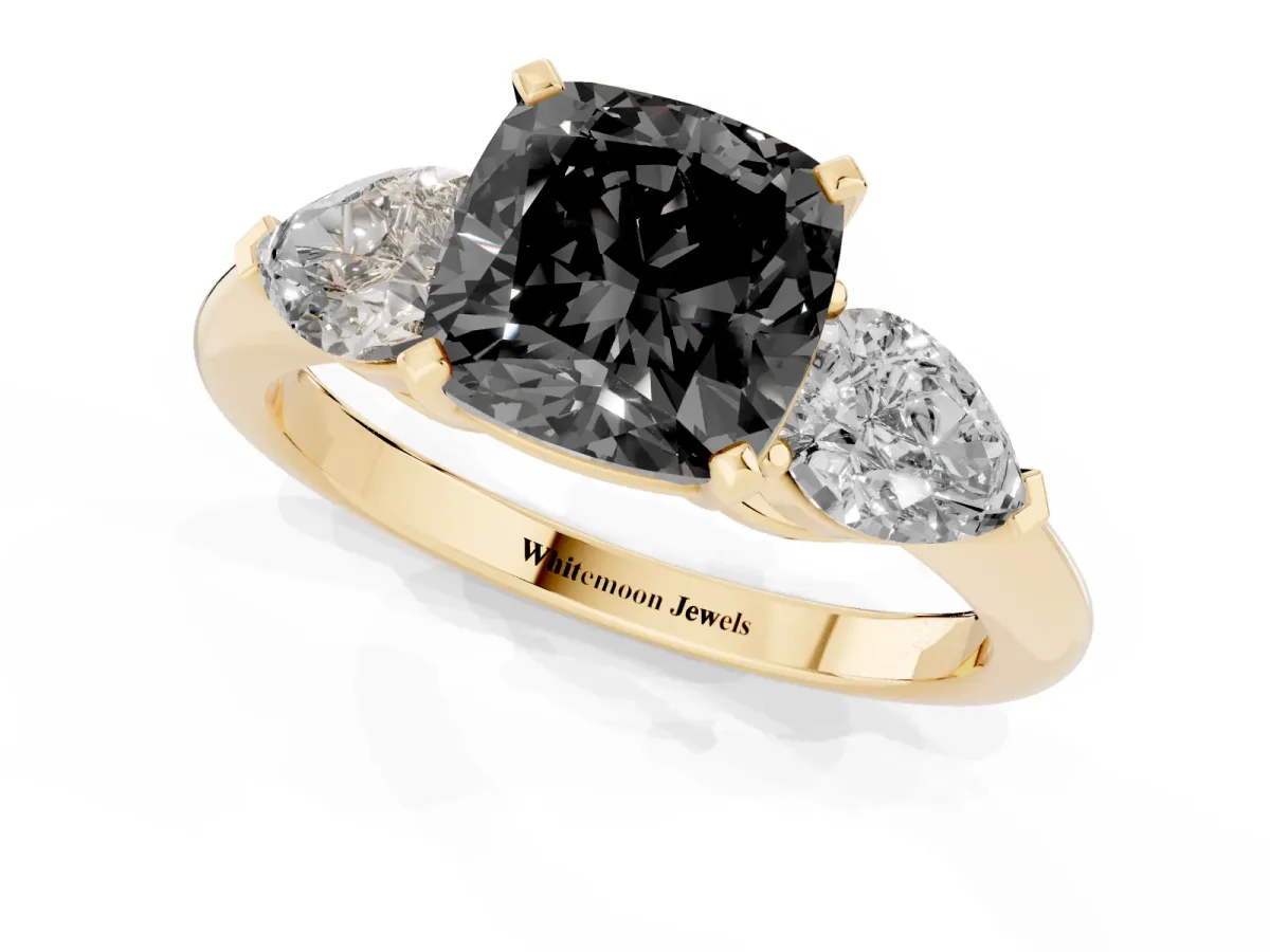 Fancy Black Three-Stone Cushion Cut Diamond Ring with Pear Side Stones and Four-Prong Setting Yellow gold