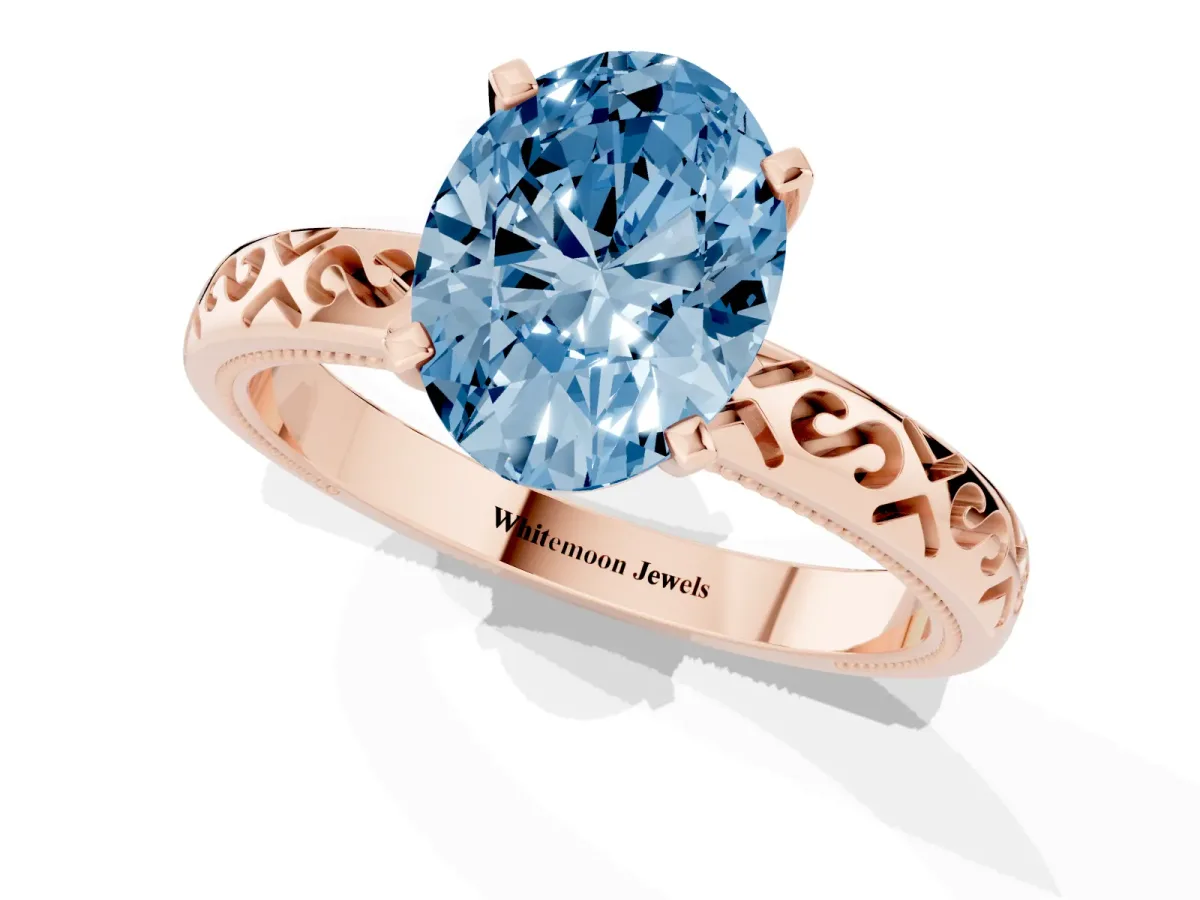 Fancy Blue Oval Cut Solitaire Engagement Ring with Scrollwork Band and Four-Prong Setting Rose gold