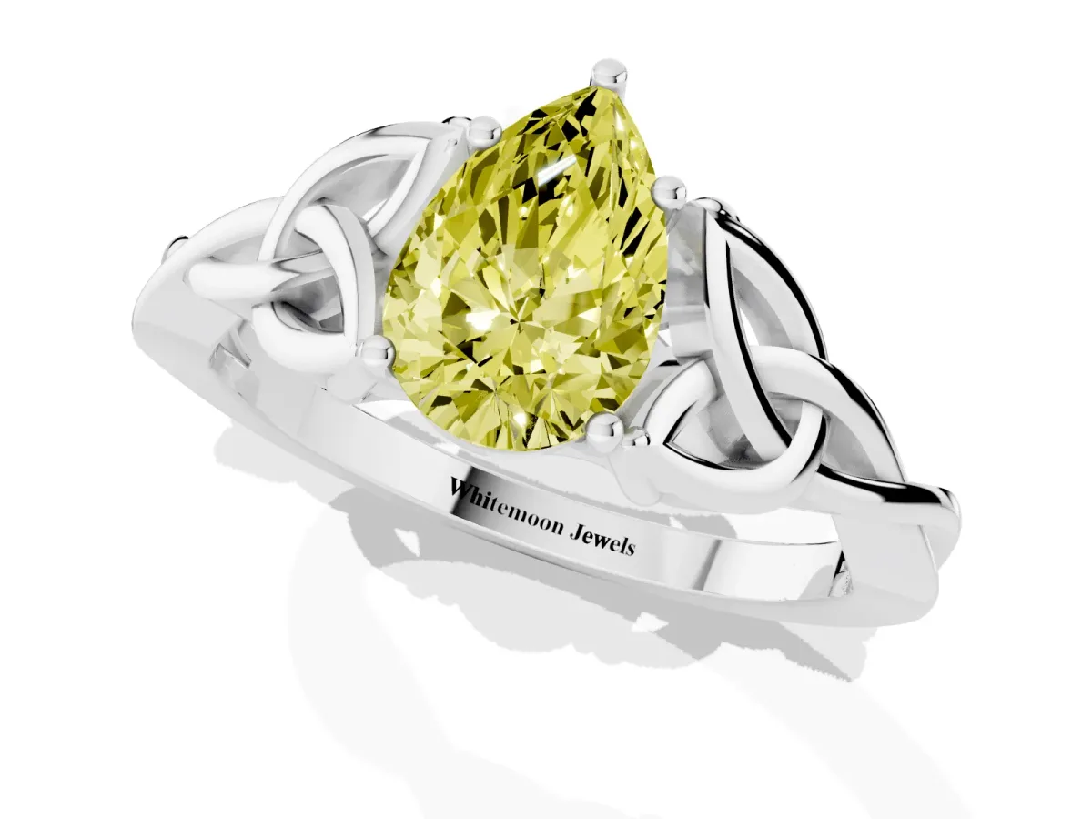 Fancy Yellow Pear Cut Diamond Solitaire Engagement Ring with Celtic Knot Band and Four-Prong Setting Silver