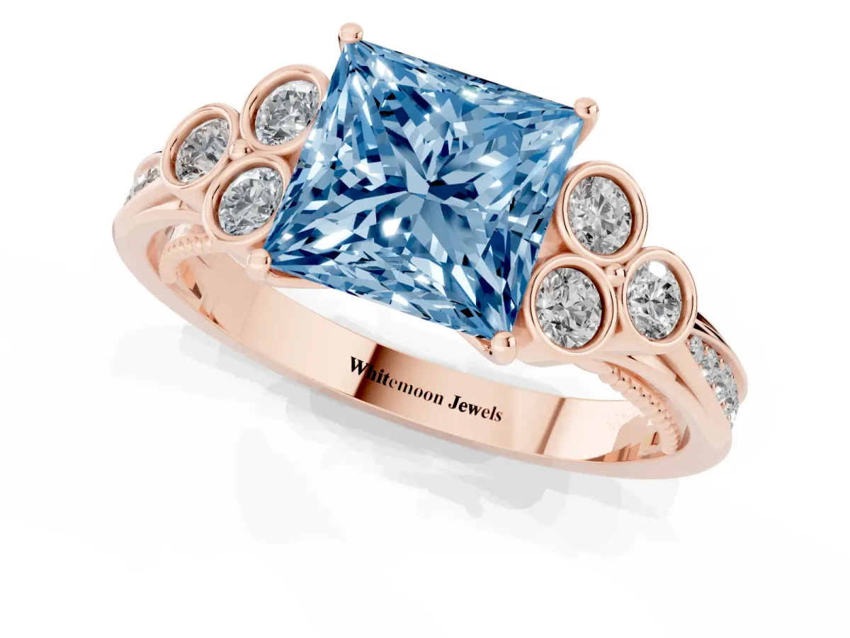 Fancy Blue Princess Cut Cut Diamond Engagement Ring with Bezel Set Round Side Stones and Prong Setting Rose gold