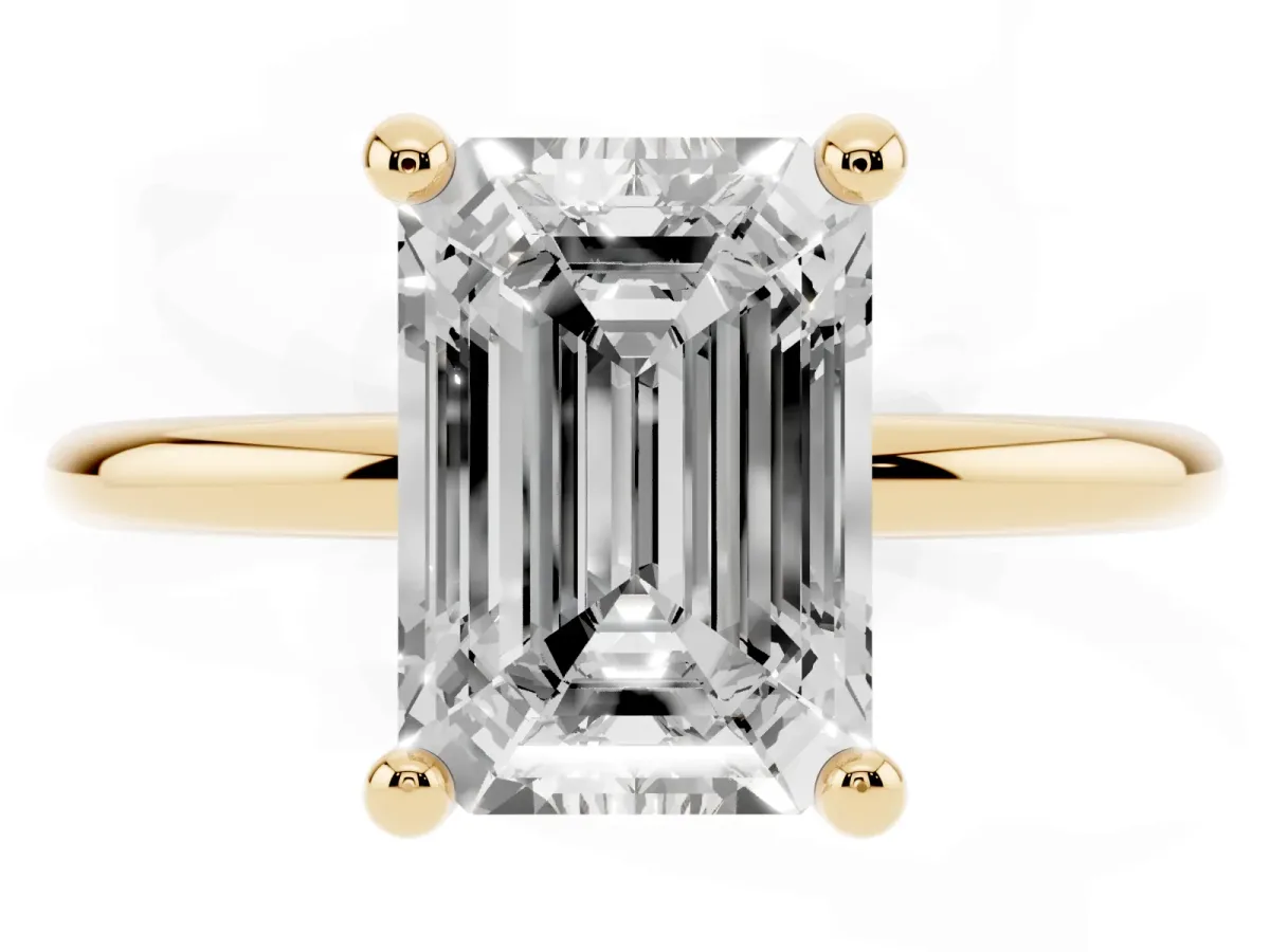 Emerald Cut Solitaire Diamond Ring with 4-Prong Setting on a Classic Band Yellow gold