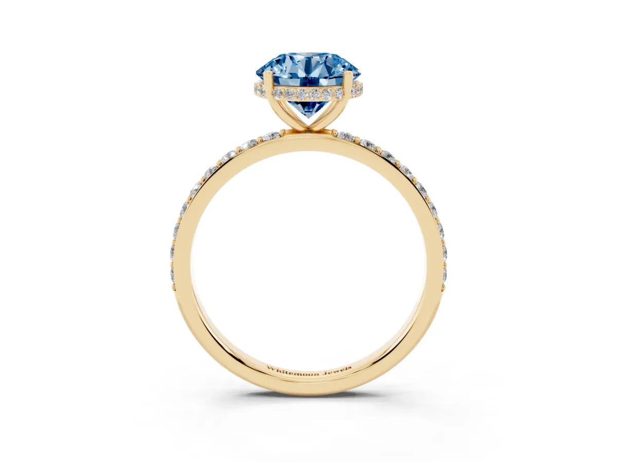Fancy Blue Round Cut Diamond Solitaire Ring with Pavé Band and Hidden Halo Yellow gold