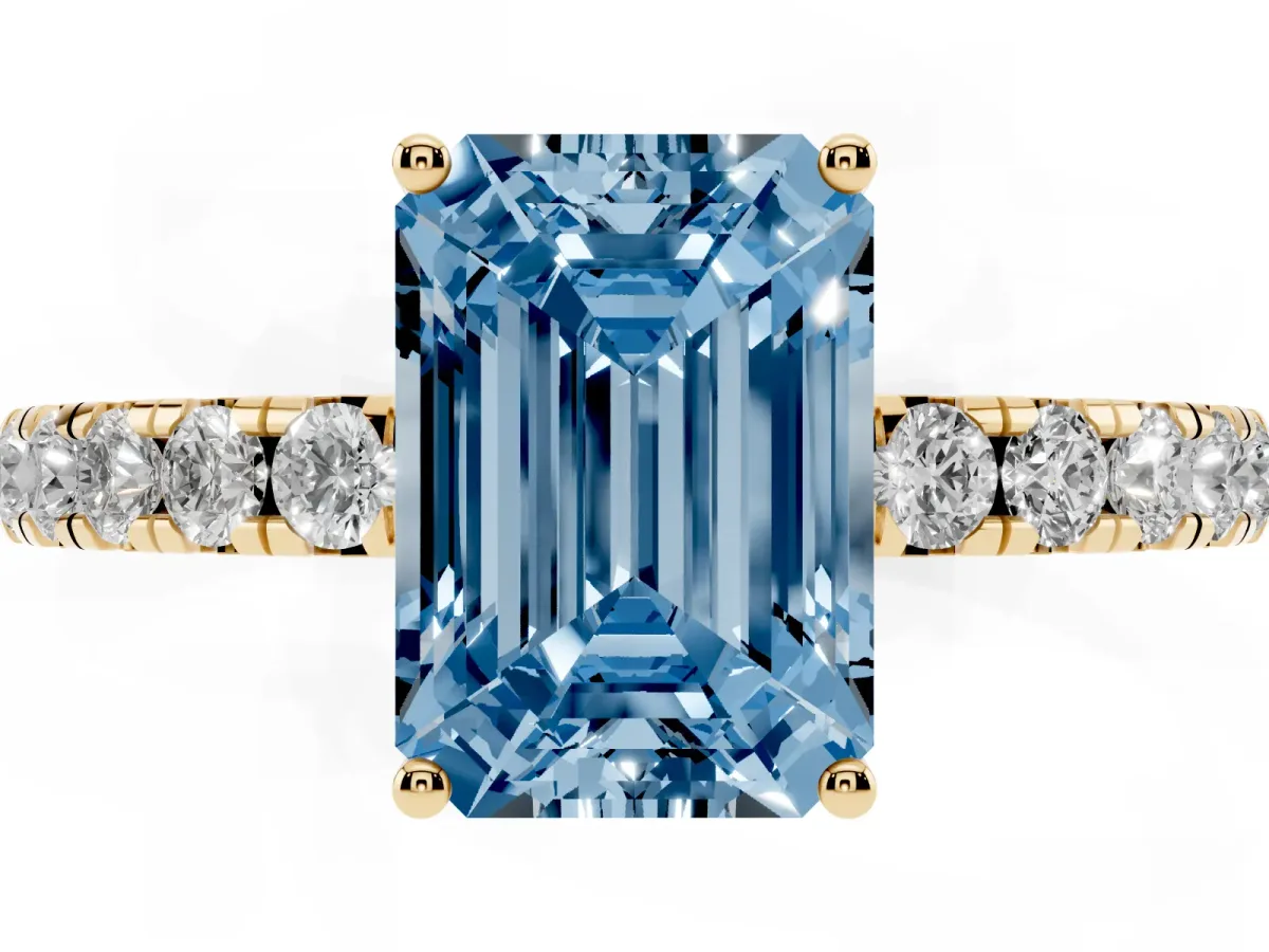 Fancy Blue Emerald Cut Diamond Pavé Solitaire Engagement Ring with Four-Prong Setting Yellow gold