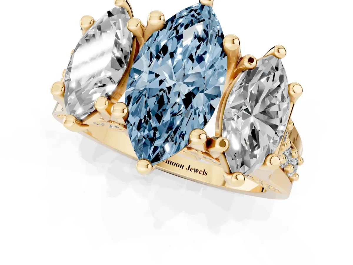 Fancy Blue Marquise Cut Diamond Three-Stone Ring with Channel Set Band and Four-Prong Setting Yellow gold