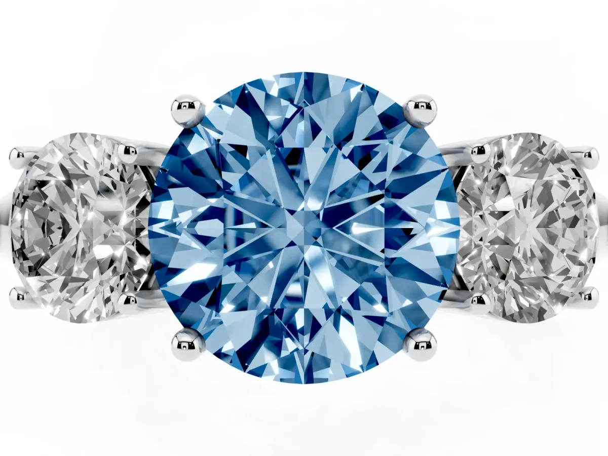 Fancy Blue Three-Stone Round Cut Cut Diamond Engagement Ring with Prong Setting on a White Gold Band Platinum
