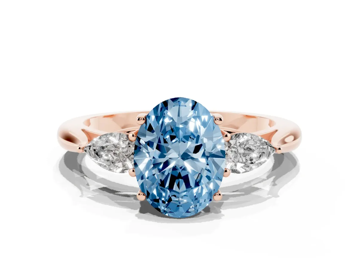 Fancy Blue Three-Stone Oval Cut Brilliant Diamond Solitaire Ring with Tapered Band and Four-Prong Setting Rose gold