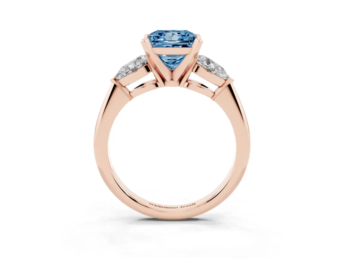 Fancy Blue Three-Stone Princess Cut Diamond Ring with Pear Side Stones and Four-Prong Setting Rose gold