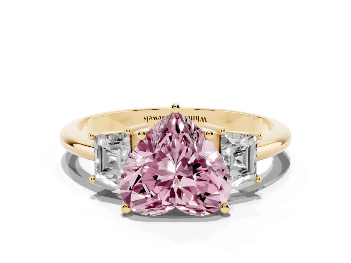 Fancy Pink Heart Cut Diamond Three-Stone Ring with Trapezoid Side Stones and Prong Setting Yellow gold