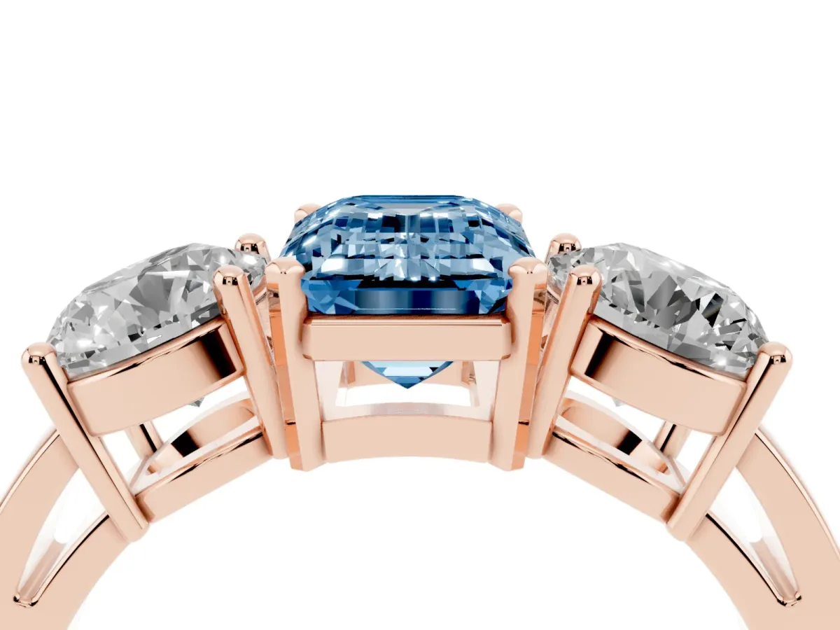Fancy Blue Three-Stone Emerald Cut Diamond Ring with Round Side Stones, Classic Band, and Four-Prong Setting Rose gold
