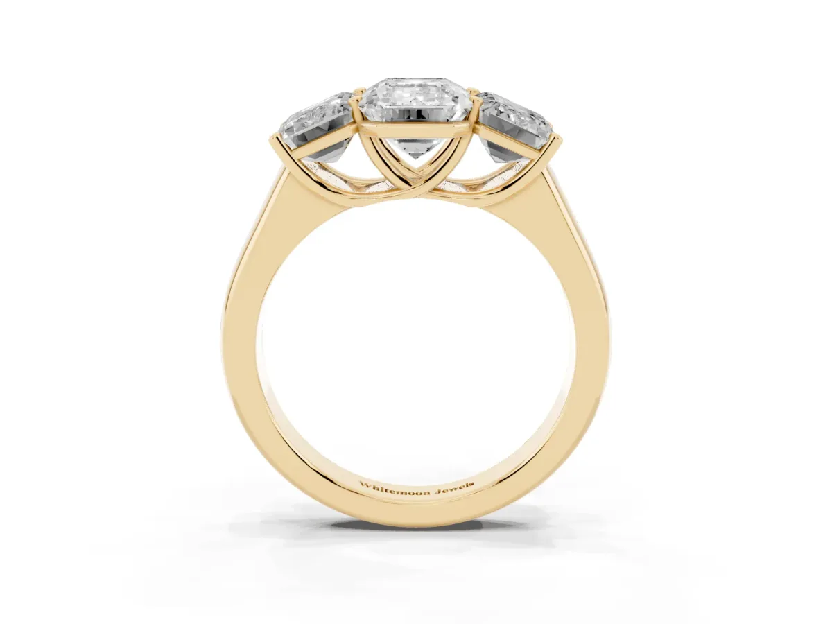 Emerald Cut Three-Stone Diamond Ring with Prong Setting on a Classic Band Yellow gold