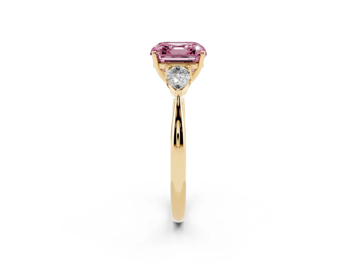 Fancy Pink Three-Stone Asscher Cut Diamond Ring with Pear Side Stones in Four-Prong Setting Yellow gold