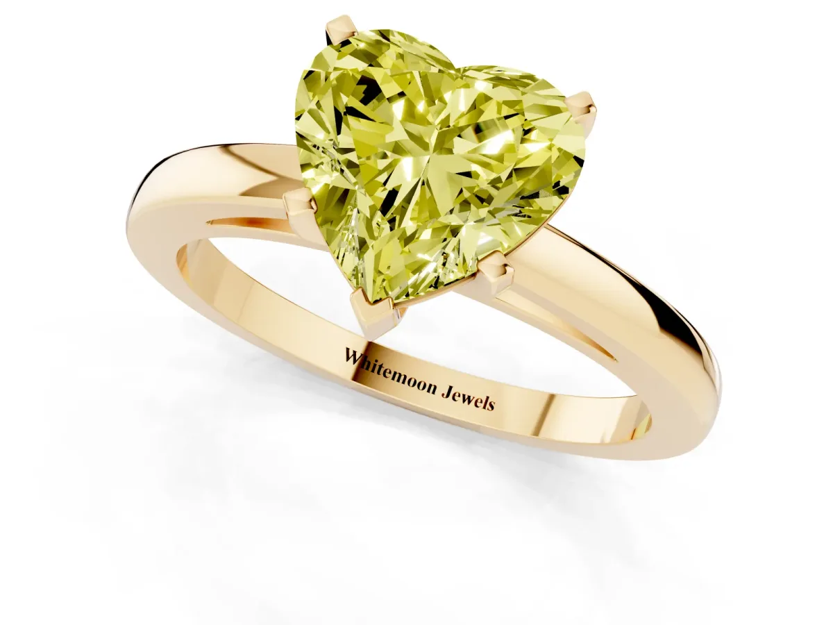 Fancy Yellow Heart Cut Solitaire Diamond Engagement Ring with Four-Prong Setting on a Classic Band Yellow gold