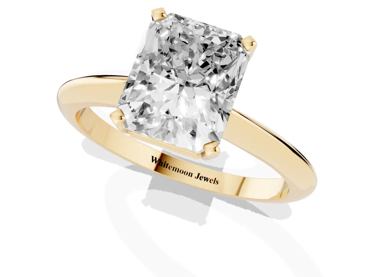 Radiant Cut Cut Solitaire Ring with Four-Prong Setting on a Classic Band Yellow gold