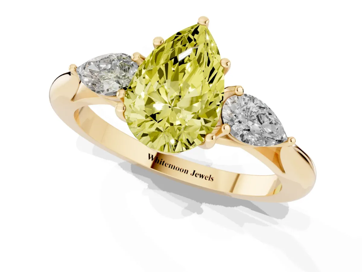 Fancy Yellow Pear Cut Diamond Three-Stone Ring with Pear Side Stones and Prong Setting Yellow gold