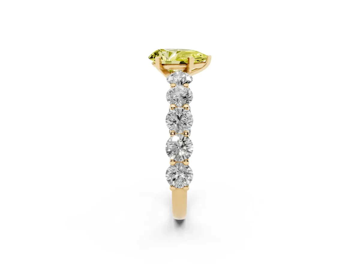 Fancy Yellow Pear Cut Diamond Prong Setting with Side Stones on a Pave Band Yellow gold