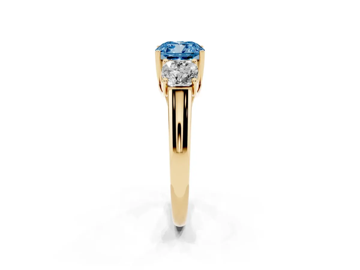 Fancy Blue Three-Stone Cushion Cut Diamond Engagement Ring with Prong Setting Yellow gold
