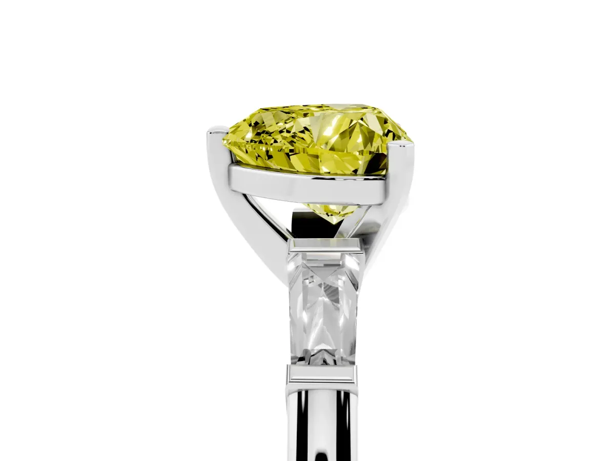 Fancy Yellow Heart Cut Solitaire with Tapered Baguette Side Stones on a Classic Band with Four-Prong Setting Platinum