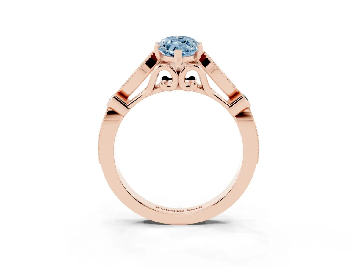 Fancy Blue Marquise Cut Cut Diamond with Milgrain Marquise and Bezel Accents on a Solitaire Band with Prong Setting Rose gold