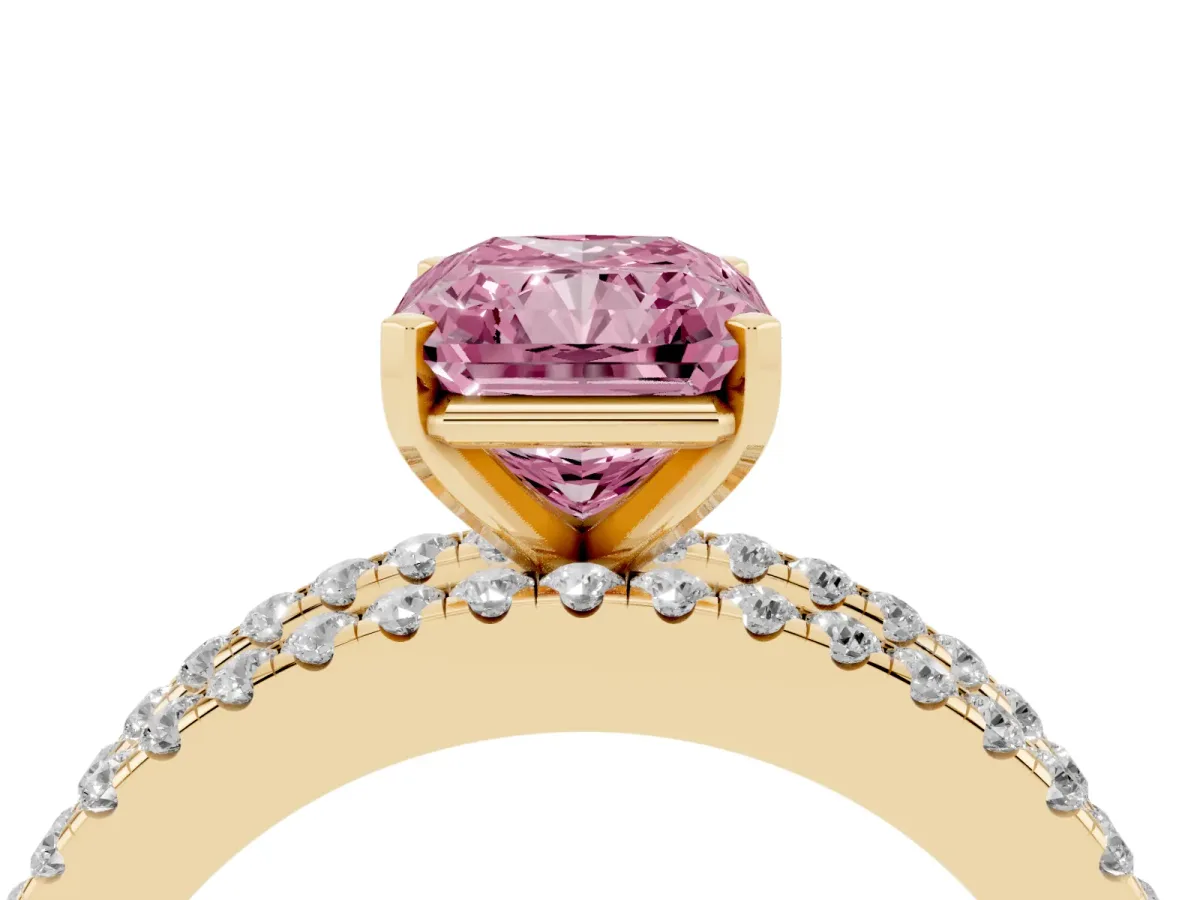 Fancy Pink Radiant Cut Diamond Solitaire Ring with Pavé and Channel Set Band Yellow gold