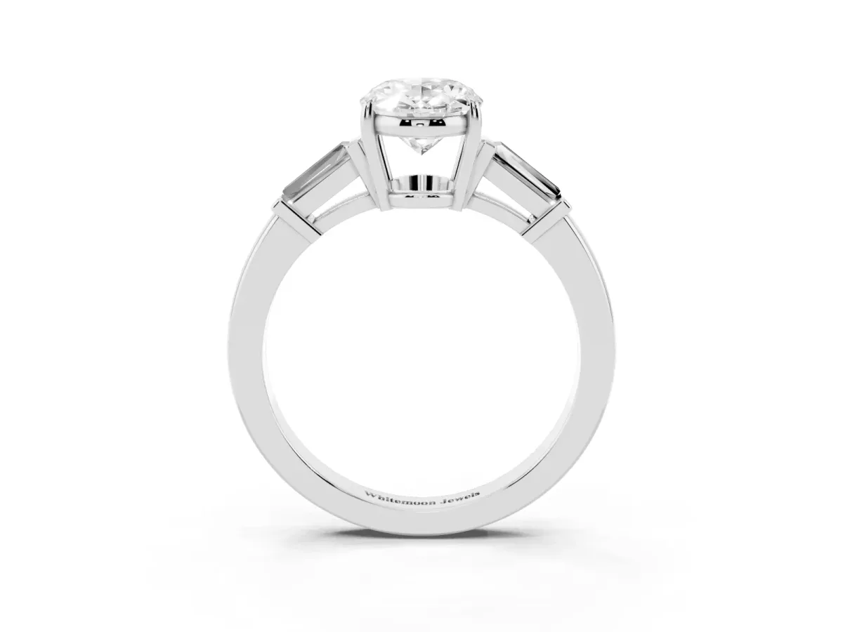 Oval Cut Diamond Three-Stone Ring with Tapered Baguette Side Stones and Prong Setting Silver