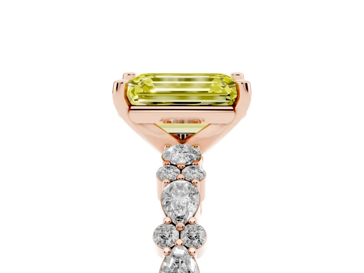 Fancy Yellow Emerald Cut Diamond Side Stone Solitaire Ring with Round and Four-Prong Setting Rose gold