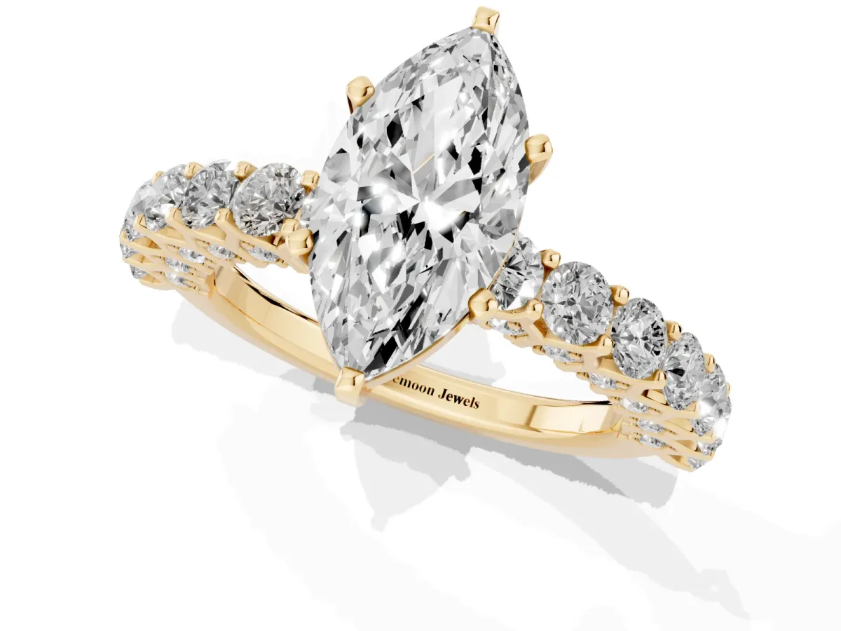 Marquise Cut Diamond Solitaire Ring with Shared Prong Pavé Band and Four-Prong Setting Yellow gold