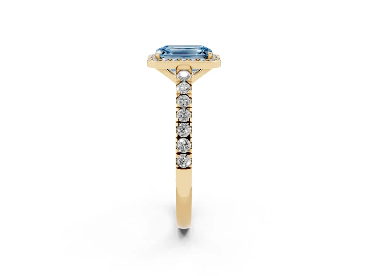 Fancy Blue Emerald Cut Cut Halo Diamond Engagement Ring with Pave Band and Four-Prong Setting Yellow gold